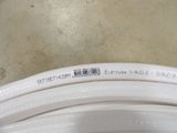 a close up of a white hose on a table