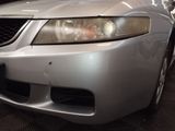 a silver car that is parked in a garage