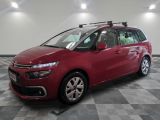 the red citrole is parked in a large room with a checkered floor