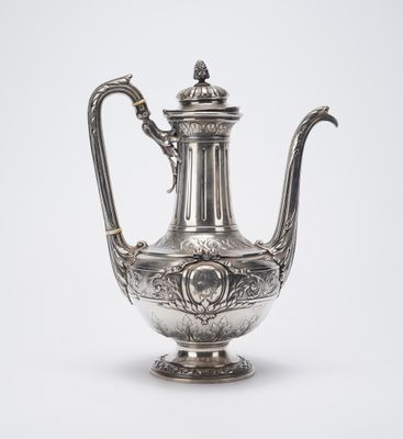 an antique silver tea pot with a handle on a white background