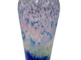 a glass vase with a blue and white design on it