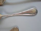 silverware on a white plate with a fork and a spoon