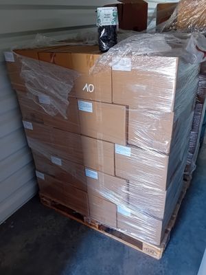 a large stack of boxes in the back of a truck