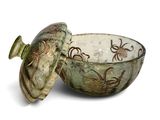 a bowl with a lid that is sitting on a table