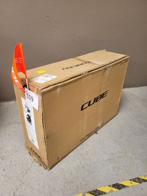 a cardboard box with an orange flag sticking out of it