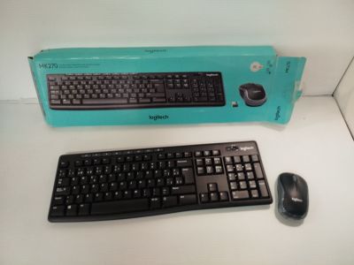 a keyboard and a mouse sitting on a table