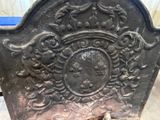 an old cast iron headboard sitting on the ground