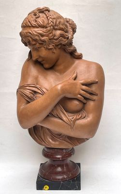 statue of a woman holding a baby in her arms