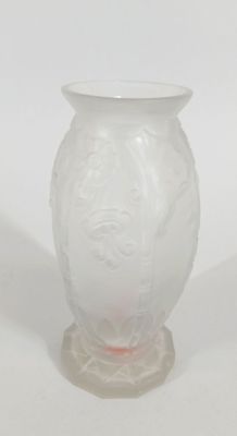 a white vase with a pink base on a white background