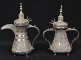 pair of antique silver plated teapots on stand