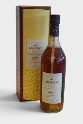 an image of a bottle of wine sitting next to a box