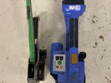two tools that are sitting on the floor next to each other