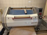 a machine that is sitting on a counter in a kitchen