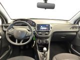 the interior of a small car with a steering wheel and dashboard