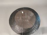 an image of a metal plate with a piece of metal on it