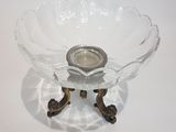a glass bowl that has a candle in it