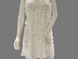 an image of a mannequin dressed in a white dress on a mannequin