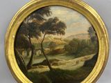 une image d'un tableau représentant un paysage dans un cadre doré