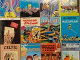 a lot of books on the wall of a room