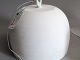 a white lamp that has a cord attached to it