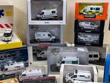 many different types of toy ambulances on the table
