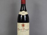 a bottle of wine that is sitting on a table