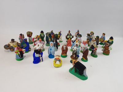 many figurines of people that are sitting on a table