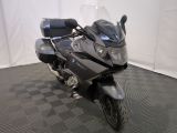 a motorcycle that is parked on a checkered floor