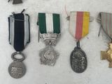 many medals and medals on display on a table