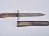two knives that are laying next to each other on a table