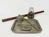 a silver tray with a pen and inkwell on it