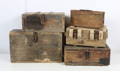 several old wooden trunks stacked on top of each other on a white surface