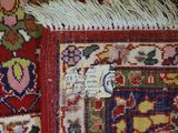 a close up of a rug with a tag on it