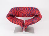 red, blue and black zebra print chair on a metal stand