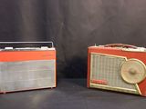 two old fashioned radio ' s sitting next to each other on a black background