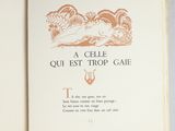 an open book with a picture of a cat on it