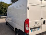 a white van that is parked in a parking lot