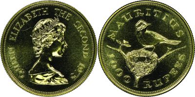 a gold sovereign coin with a bird on top of it