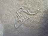a close up of a white towel with a logo on it