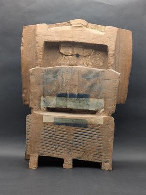 an image of a wooden sculpture of a man ' s head