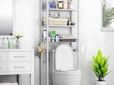 a white toilet sitting next to a white cabinet in a bathroom