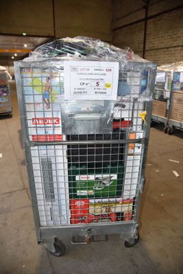 a metal cart with a sign on it in a warehouse