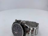 the watch is sitting on a white surface with a white background