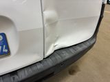 a close up of the front bumper of a white truck