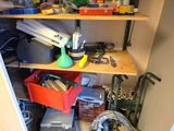 a shelf full of tools and other items in a room