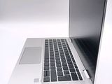 a close up of a laptop computer on a white surface