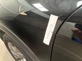 a sticker on the side of a black car