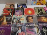 a lot of music cds and cds on the table