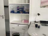 a white desk and a white refrigerator in a room