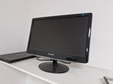 a computer monitor sitting on top of a white desk